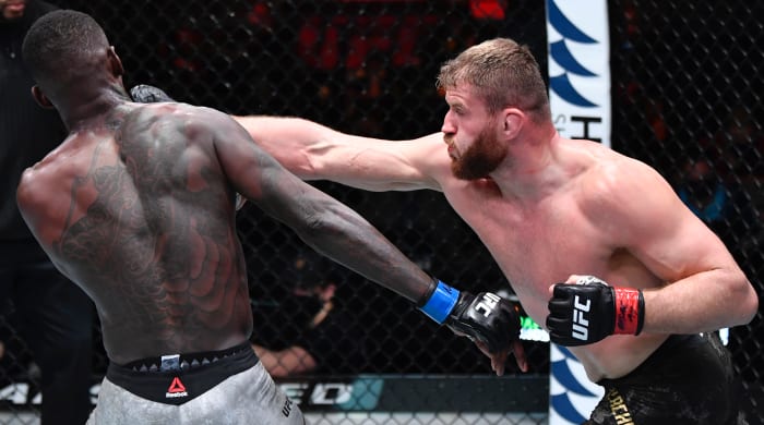 Jan Blachowicz of Poland punches Israel Adesanya of Nigeria in their UFC light heavyweight championship fight during the UFC 259 event at UFC APEX on March 06, 2021 in Las Vegas, Nevada.